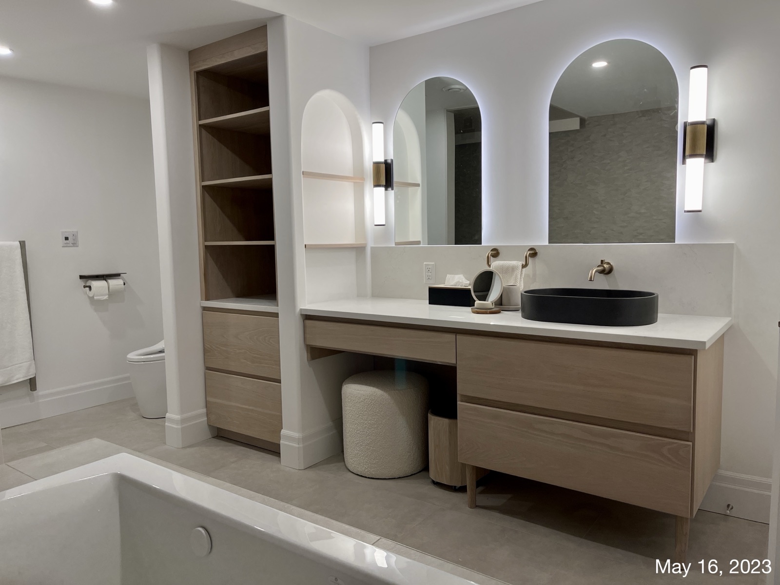Bathroom vanity, millwork, and color-balanced design detail
